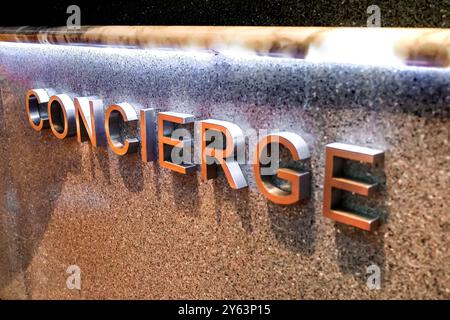 Concierge sign at the reception counter of a hotel Stock Photo