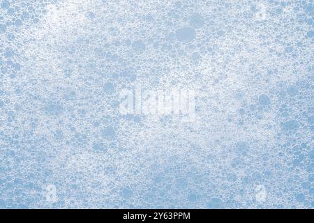 Close-up view of soap bubbles on a light blue background creating abstract patterns Stock Photo