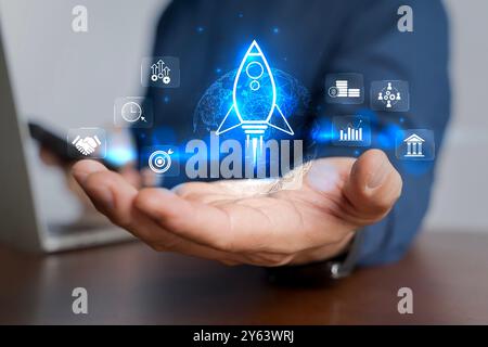 Businessman and rocket start flying up and network line connection. Startup concept strategy launch Startup growth, plan development business project Stock Photo