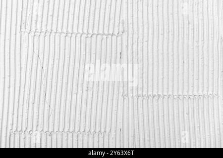 White wall with decorative stucco relief pattern. Front view, background photo texture Stock Photo