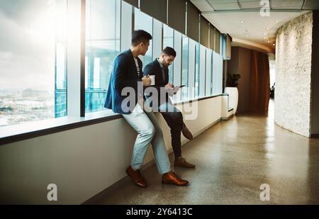 Friends, tablet and business people in office for planning, rpa management and ai software development. Networking, technology and chatbot project Stock Photo