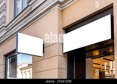 Two Mock Ups Of Restaurant Blank White Rectangular Street Signboards On Yellow Wall Stock Photo