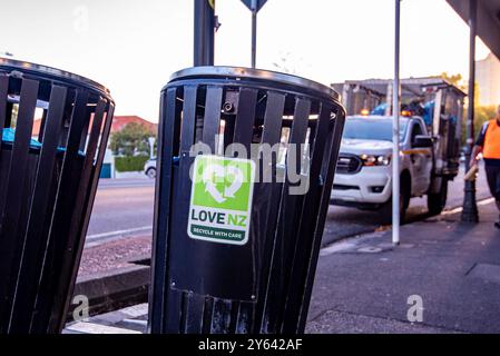 A Love NZ Recycle with Care sticker, decal on a rubbish bin about to be emptied on a main street in Ponsonby, Auckland New Zealand Stock Photo