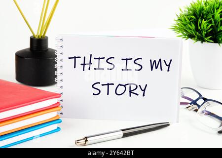 This is my Story, business motivational inspirational quotes concept THIS IS MY STORY on a white sheet of an open notebook Stock Photo