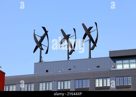 Helical shaped Vertical Axis Wind Turbines located on top of Pearson Court Square, a residential building in Long Island City, New York City. Stock Photo