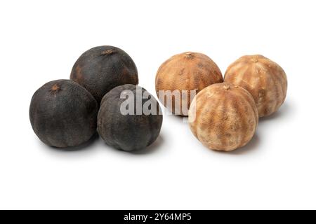 Whole dried black limes, loomi, and dried white limes isolated on white background close up Stock Photo