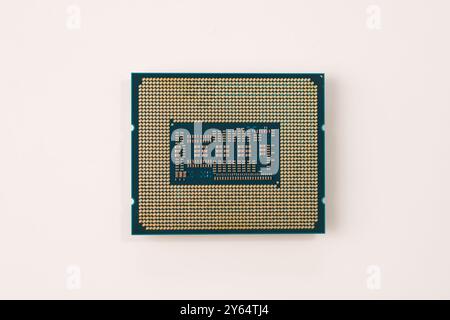 Closeup of the back of a computer processor chip isolated on white background Stock Photo