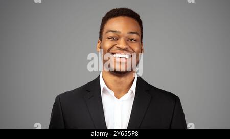 Young smiling black guy over white background Stock Photo