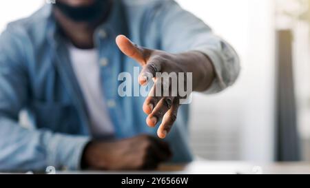 HR manager extending hand for handshake after successful job interview Stock Photo