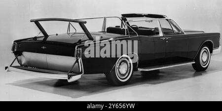 One of  two identical  Lincoln Continental convertibles to be used by the United States Secret Service to carry VIPs. The cars have 11 in wide running boards and assist bars for agents. Another retractable platform and bar is at the rear .  The convertible top is transparent to allow scanning of rooftops and other high structures .There is a rear facing seat next to the driver to enable a watch to be kept behind .  In addition to all this there are a battery of sirens, public address speakers and red emergency flashing lights , with an electronic communications system .  26 October 1967 Stock Photo