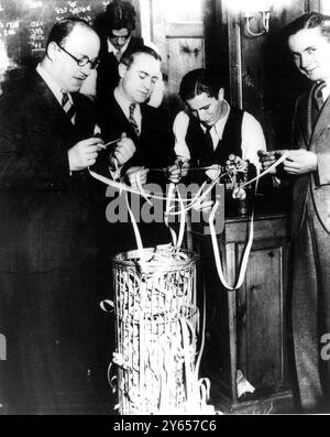 The stock market crash in 1929. Money traders watch the ticker tape following the Wall Street Crash in the USA in 1929. Stock Photo