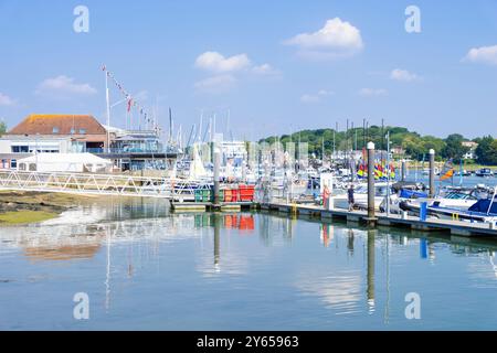 Lymington UK  -  Royal Lymington Yacht Club with Yachts and small boats moored on the Lymington River at the sailing Club Lymington Hampshire England Stock Photo