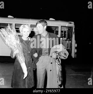 French film actor Jean-Paul Belmondo with American actress Jean Seberg are pictured on their arrival in Beirut , Lebanon on 4 April 1964 .  They are here to film major roles in the French movie ' Escape in Freedom ' . 6 April 1964 Stock Photo