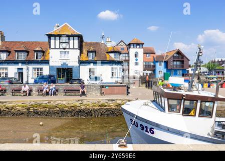 Lymington Quay - People sat by The Ship Inn on Lymington Town Quay in Lymington Hampshire a town in the New Forest Hampshire England UK GB Europe Stock Photo