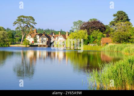 Beaulieu uk house and lake at the Mill Dam in Beaulieu Village in the New Forest National Park Hampshire England UK GB Europe Stock Photo