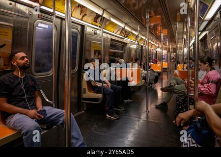 People ride Subway train in New York. With 1.67 billion annual rides, New York City Subway is the 7th busiest metro system in the world. Stock Photo