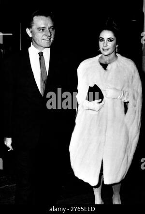 Gstaad , Switzerland :  Hollywood ' s Elizabeth Taylor and her Welsh actor husband , Richard Burton are spending Christmas and New Year in their chalet here .  Our picture shows Richard and his wife , arriving for last night ' s gala evening of the Palace Hotel here which is celebrating it ' s 50th anniversary . 27 December 1964 Stock Photo