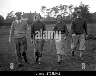 Mixed foursomes golf match at the Worplesdon Golf Club .  Captain GCB Stevens , Miss D Pearson and Mr and Mrs CK Elliott . 1935 Stock Photo