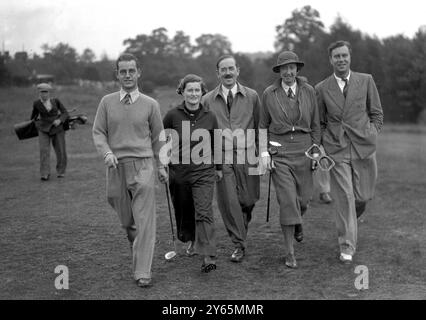 Mixed foursomes golf match at the Worplesdon Golf Club .  From left to right  ;- A McNair , Mrs Fane , GFC Harrison and Miss J Jackson going on to the 6th hole . 14th October 1935 Stock Photo