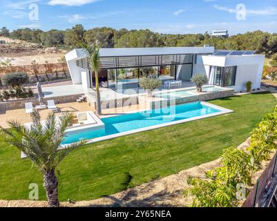 Panoramic aerial view of large swimming pool with bar at a luxury ...