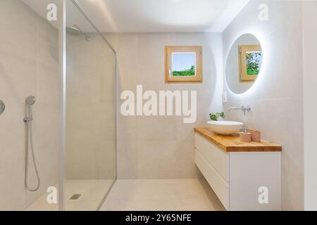 Elegant bathroom in an Ibizan villa with a modern and minimalist design with a light color palette Stock Photo