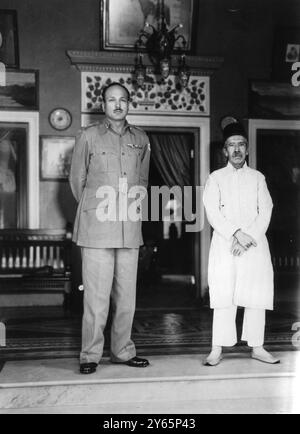 His Exalted Highness the Nizam of Hyderabad ( right ) poses with Hyderabad ' s Governor General , Major - General JN Chowdhari before taking tea at the Nizam ' s Keng Kothi Palace on a recent visit . 18th October 1948 Stock Photo