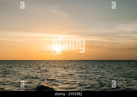 A breathtaking sunset over the ocean in Varadero, Cuba, capturing the radiant colors and tranquil waters Stock Photo