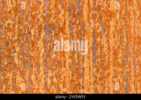 High-resolution image capturing the detailed patterns of corrosion and decay on a rusty metal surface, showcasing a mix of orange and brown hues. Stock Photo