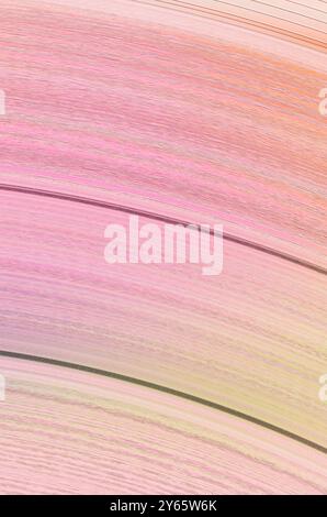 Pastel pink and beige tones flow in an abstract, wavy texture, creating a serene and versatile background. Stock Photo