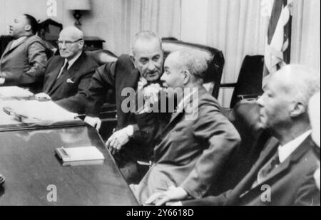 Washington : President Lyndon B. Johnson  meets leaders of civil rights oganisations at the White House . From Left : Dr Martin Luther King Jr , President Southern Christian Leadership ; Rep Emmanuel Celler , D . N.  Y . , President Johnson ; Roy Wilkins , Director , N AACP , and A . Phillip Randolph , Vice Present A . F . L . C. I . O .  29 April 1966 Stock Photo