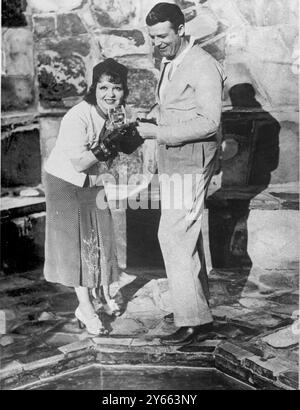 George Beldam Jr Clara Bow and husband Rex Bell hold up their marriage certificate, 1931 ...