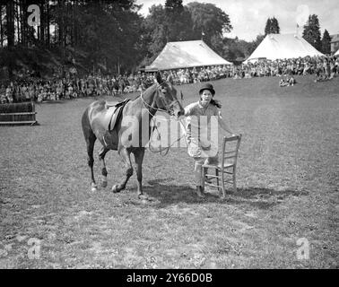 Haywards Heath Horticultural Society's Summer show, Victoria Park, Haywards Heath, Sussex. Girl with pony in Musical Chairs competition.   9 July 1936 Stock Photo