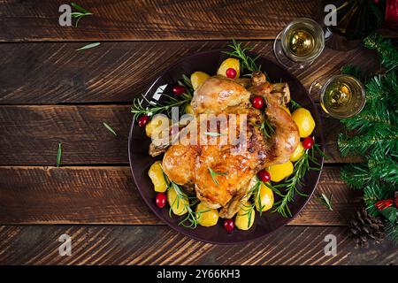 Baked chicken or baked turkey. The Christmas table is served with a turkey. Fried chicken, table setting. Christmas dinner. Flat lay. Top view Stock Photo
