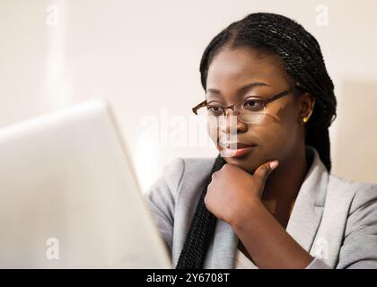 Cleseup Portrait Of Professional Financial Consultant In Glasses Using Digital Tablet Stock Photo