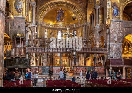 People walking in front of The High Altar inside St Mark's Basilica ,Venice ,Italy Stock Photo