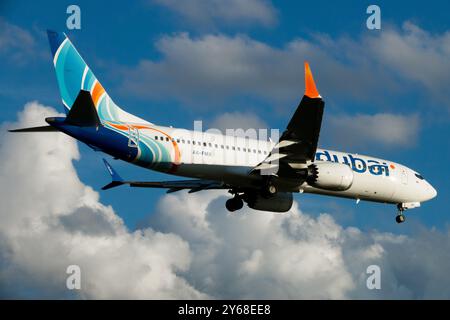 Boeing 737 MAX 8 FlyDubai Plane Aircraft Airplane Jetliner Passenger Jet Airliner Against Blue Sky Cloud Clouds Stock Photo