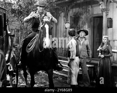 Rory Calhoun, Lon Chaney, Jr., Corinne Calvet, on-set of the western film, 'Apache Uprising', Paramount Pictures, 1965 Stock Photo