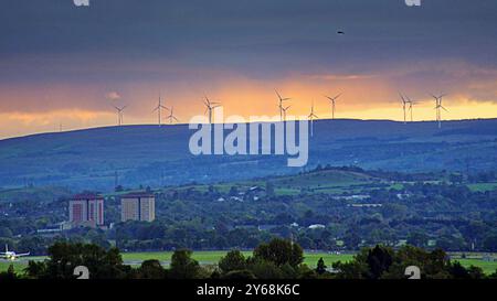 Glasgow, Scotland, UK. 24th September, 2024. UK Weather:  Red sunset light over of the city.  An empty glasgow airport with linwood and johnstone in the background. Credit Gerard Ferry/17�Թ����� Live News Stock Photo