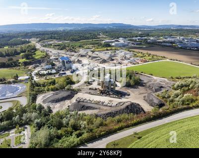 Aerial view of a gravel pit, gravel extraction area, gravel works, asphalt mixing plant and building materials warehouse in the Steisslingen industria Stock Photo