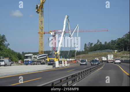 Construction cranes at a building site on the A6 motorway, Bavaria, Germany, Europe Stock Photo