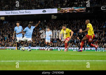 Manchester, UK. 24th Sep, 2024. Manchester City forward Jeremy Doku (11) scores his side's first goal of the game 1-0 during the Manchester City FC v Watford FC Carabao Cup 3rd Round match at the Etihad Stadium, Manchester, England, United Kingdom on 24 September 2024 Credit: Every Second Media/Alamy Live News Stock Photo