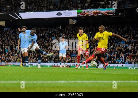 Manchester, UK. 24th Sep, 2024. Manchester City forward Jeremy Doku (11) scores his side's first goal of the game during the Manchester City FC v Watford FC Carabao Cup 3rd Round match at the Etihad Stadium, Manchester, England, United Kingdom on 24 September 2024 Credit: Every Second Media/Alamy Live News Stock Photo