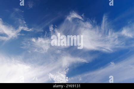 High-altitude cirrus clouds at blue sky , Finland Stock Photo
