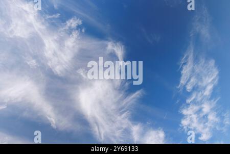 High-altitude cirrus clouds at blue sky , Finland Stock Photo