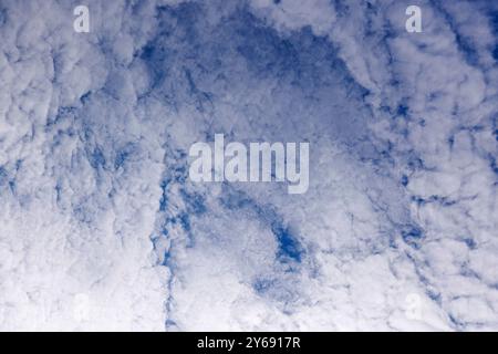 Altocumulus clouds covering blue sky, Finland Stock Photo