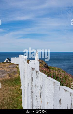 White fence and modern lighthouse at Cape Spear Lighthouse National Historic Site in St. John's, Newfoundland & Labrador, Canada Stock Photo