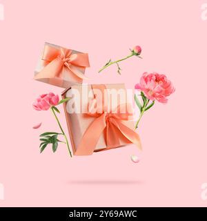 Gift boxes and peony flowers in air on pink background Stock Photo