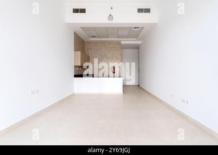 empty small room, kitchen, wall cabinet,glossy tiled floors and white walls,  wide angle Stock Photo