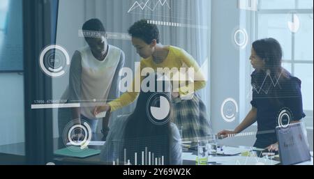 Business data analytics image over diverse team collaborating in office Stock Photo