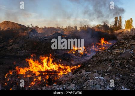 Burning garbage at landfill. Air pollution concept. Stock Photo